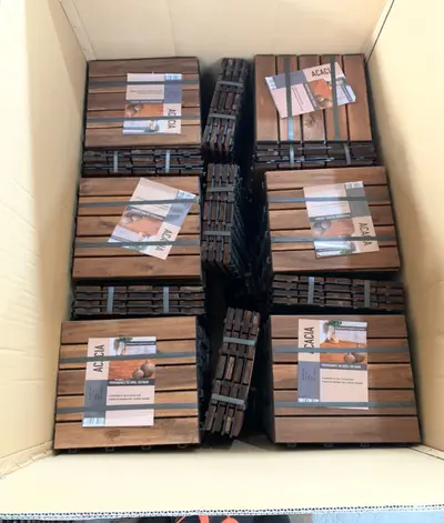 Acacia tiles packed in cartons